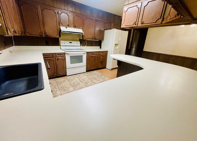 111 Van Deman Ct, Fitzgerald, GA 31750 - kitchen with white appliances, extractor fan, a sink, and light countertops