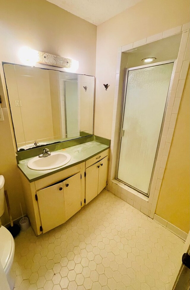 111 Van Deman Ct, Fitzgerald, GA 31750 - bathroom with toilet, a stall shower, and vanity