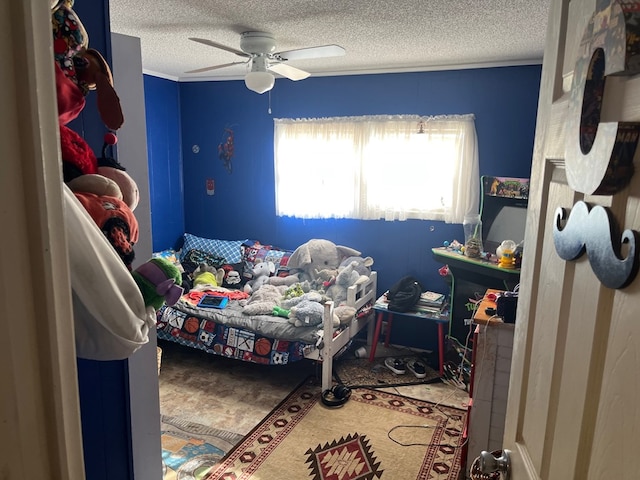 bedroom with a textured ceiling and a ceiling fan