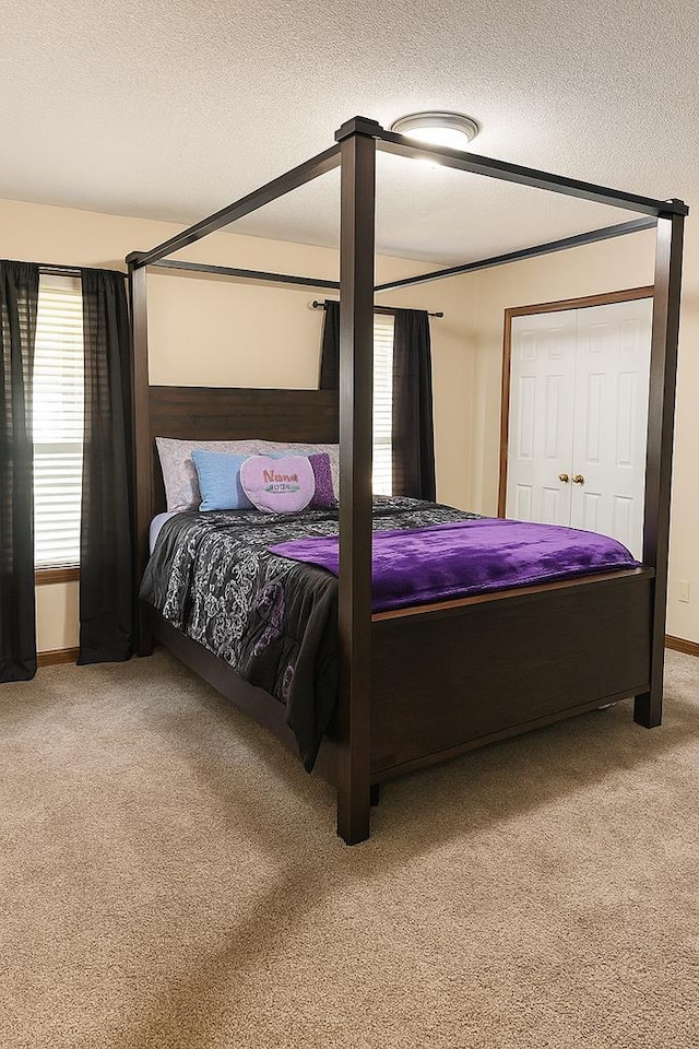 2211 Greenoch Ave, Albany, GA 31721 - carpeted bedroom with a textured ceiling