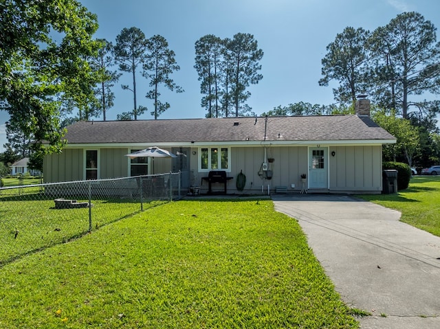 127 Carol Cir, Fitzgerald, GA 31750 - ranch-style house featuring board and batten siding, a chimney, driveway, and roof with shingles