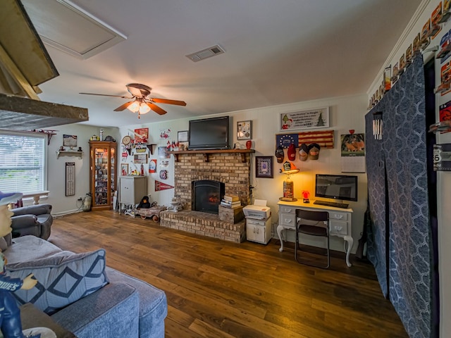 127 Carol Cir, Fitzgerald, GA 31750 - living room with wood-type flooring, a brick fireplace, and a ceiling fan