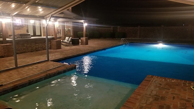 pool at twilight with a fenced in pool, a patio area, glass enclosure, and fence