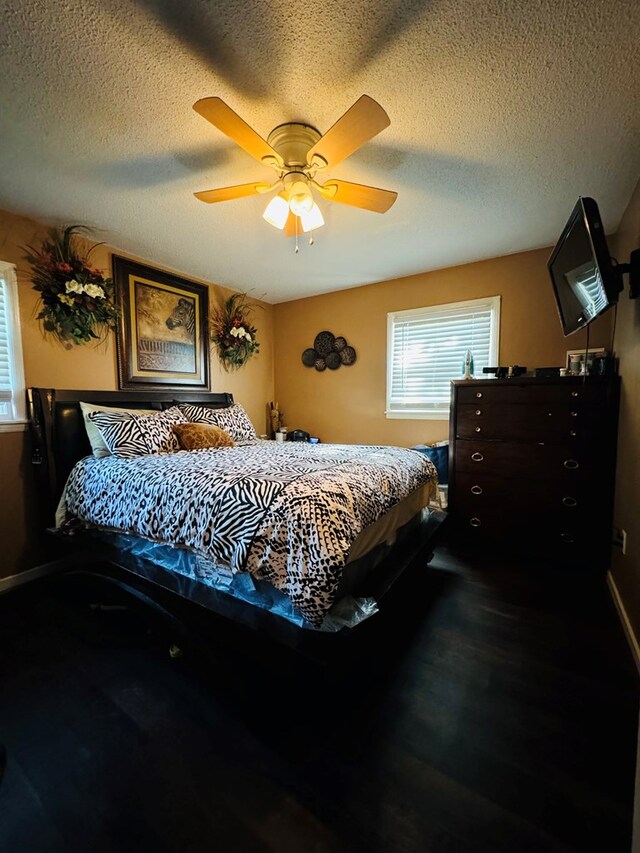 106 Pendley St, Sylvester, GA 31791 - bedroom featuring ceiling fan, a textured ceiling, and dark wood-style floors