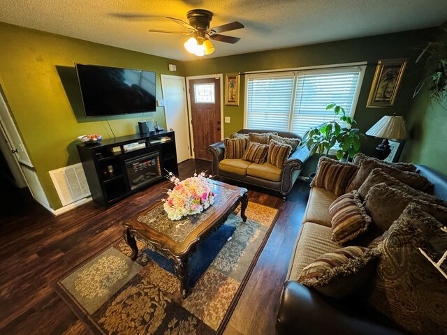 106 Pendley St, Sylvester, GA 31791 - living area featuring visible vents, a textured ceiling, a ceiling fan, and wood finished floors