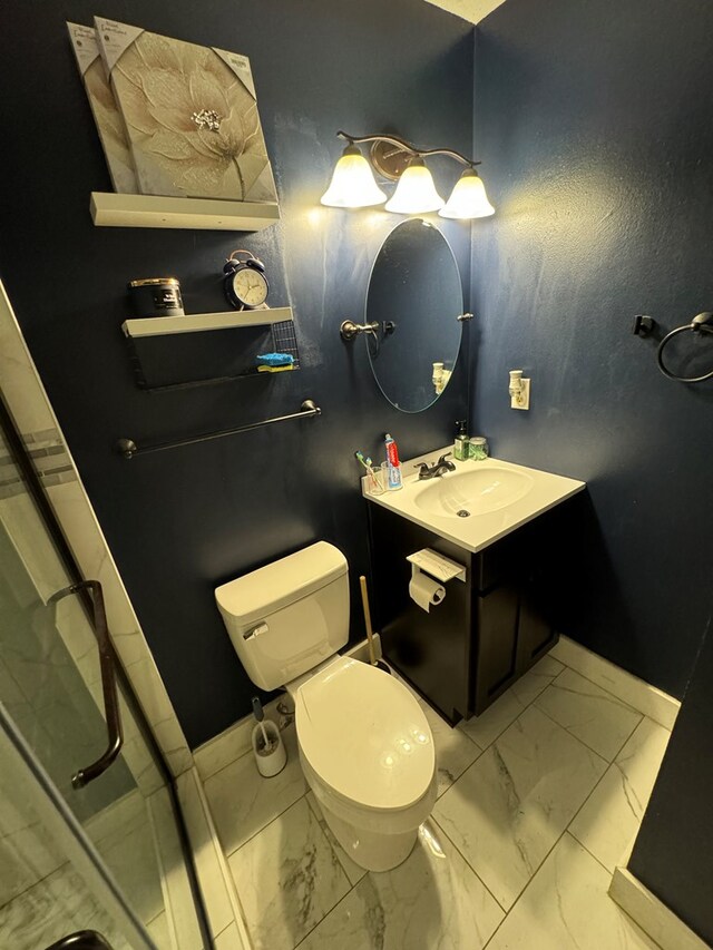 106 Pendley St, Sylvester, GA 31791 - bathroom featuring vanity, marble finish floor, baseboards, and toilet