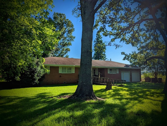 ranch-style home featuring crawl space, a garage, a front yard, and brick siding