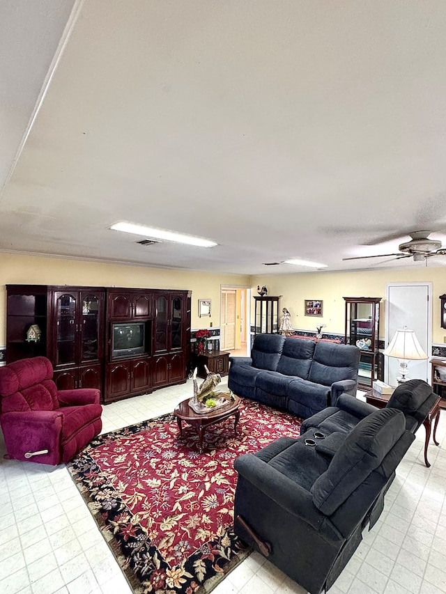 living room featuring visible vents, ceiling fan, and light floors