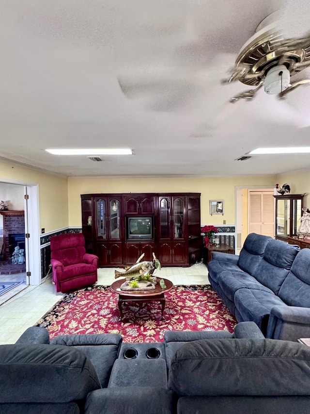 living area with visible vents and a textured ceiling