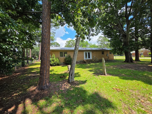 124 N Main St, Fitzgerald, GA 31750 - view of yard featuring entry steps and french doors