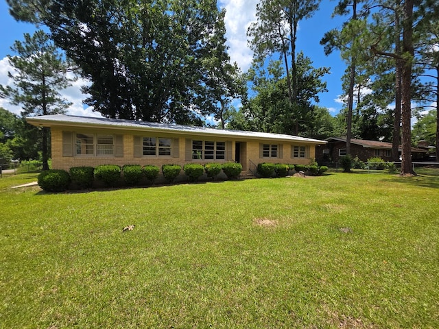 124 N Main St, Fitzgerald, GA 31750 - view of front of house with a front lawn and brick siding