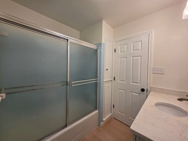 124 N Main St, Fitzgerald, GA 31750 - bathroom featuring shower / bath combination with glass door, wood finished floors, and vanity