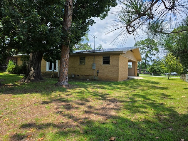 124 N Main St, Fitzgerald, GA 31750 - view of home's exterior with brick siding and crawl space