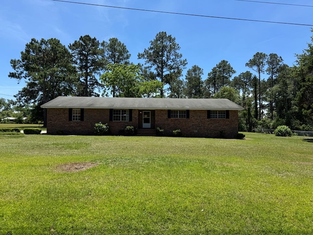 142 Elva Cir, Enigma, GA 31749 - ranch-style house with brick siding and a front lawn
