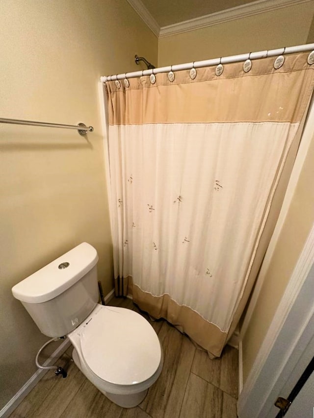102 Irwinville Hwy, Fitzgerald, GA 31750 - full bathroom with toilet, wood finished floors, and ornamental molding