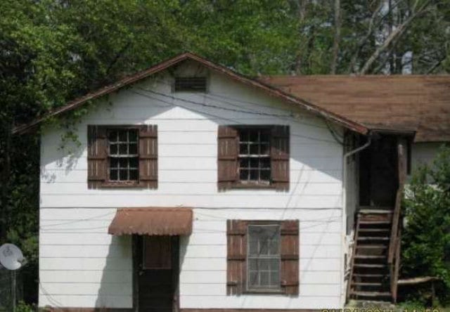 view of home's exterior with stairway