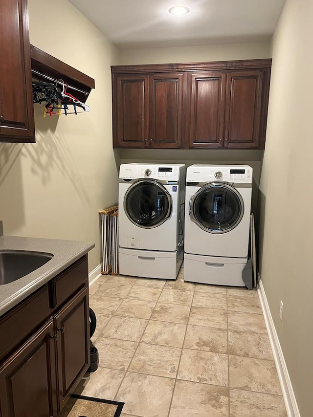 219 Cypress Ridge Rd, Tifton, GA 31794 - laundry room featuring cabinet space, washer and clothes dryer, and baseboards