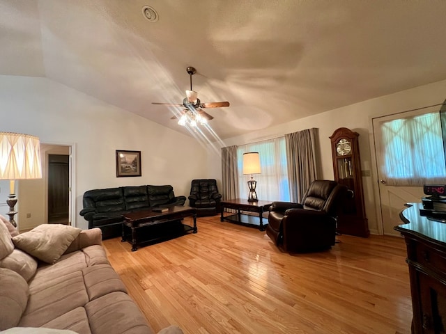 109 Preston Dr, Fitzgerald, GA 31750 - living area featuring ceiling fan, light wood-style floors, vaulted ceiling, and healthy amount of natural light