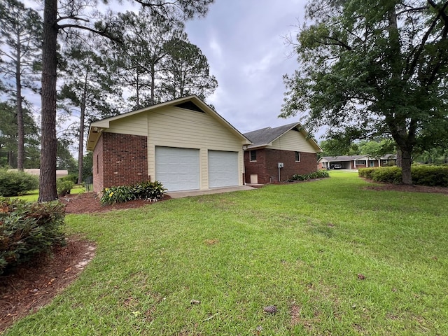 109 Preston Dr, Fitzgerald, GA 31750 - view of home's exterior featuring brick siding, a garage, a yard, and driveway