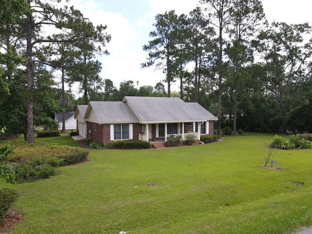 109 Preston Dr, Fitzgerald, GA 31750 - ranch-style home with an attached garage, brick siding, a front yard, and a porch