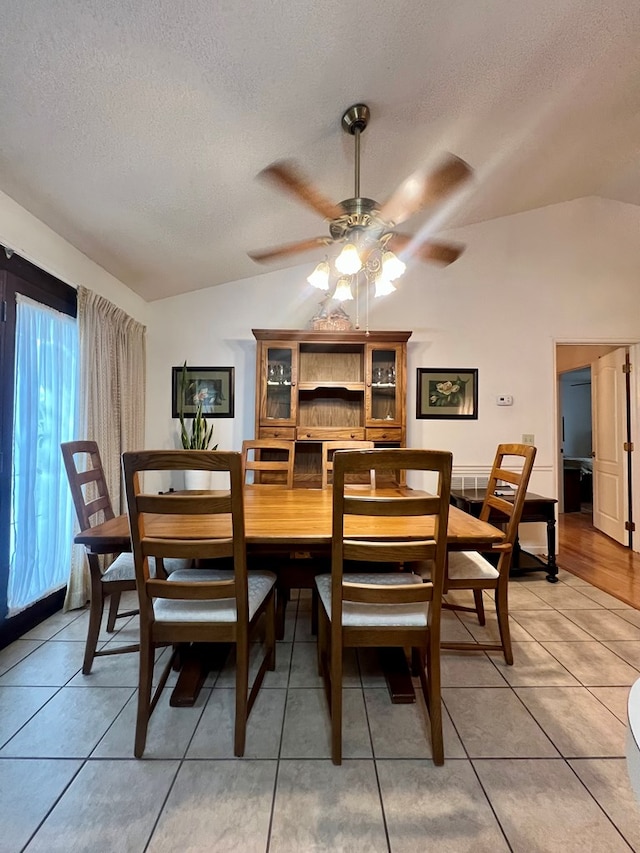 109 Preston Dr, Fitzgerald, GA 31750 - dining space featuring vaulted ceiling, a textured ceiling, a ceiling fan, and light tile patterned floors