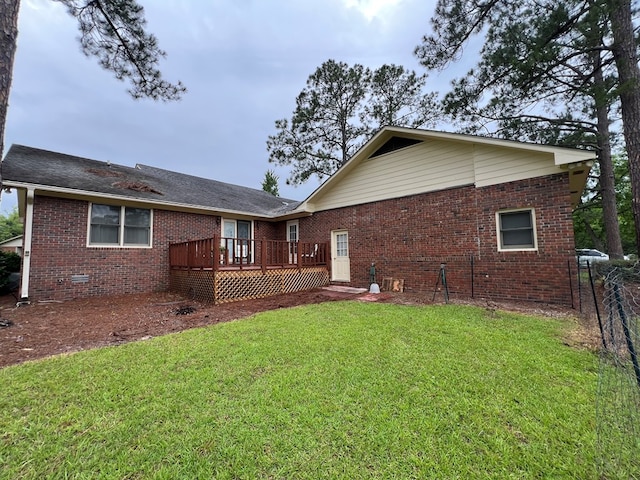 109 Preston Dr, Fitzgerald, GA 31750 - rear view of property with brick siding and a deck