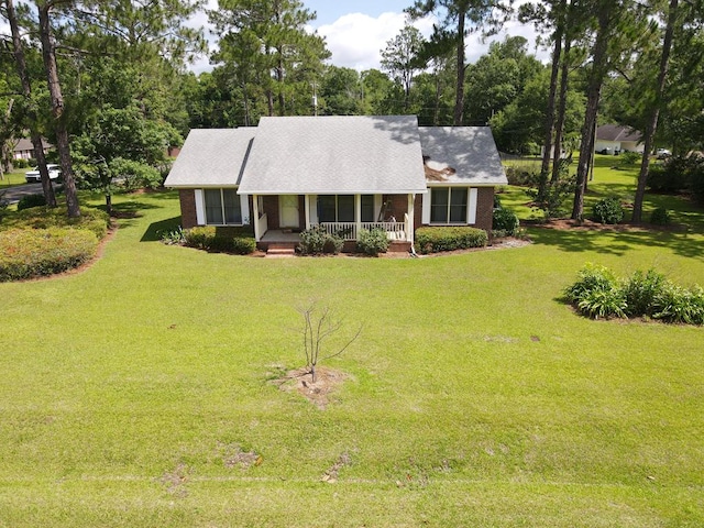 109 Preston Dr, Fitzgerald, GA 31750 - view of front of home featuring a porch, a front yard, and brick siding