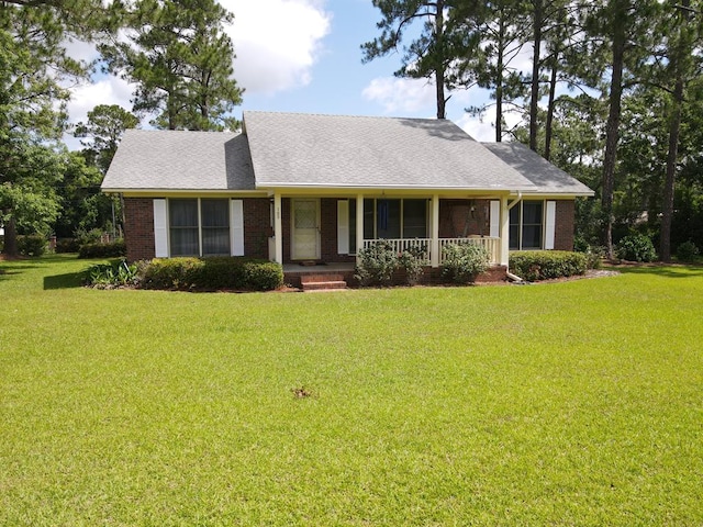 109 Preston Dr, Fitzgerald, GA 31750 - view of front of property featuring a front yard, covered porch, and brick siding