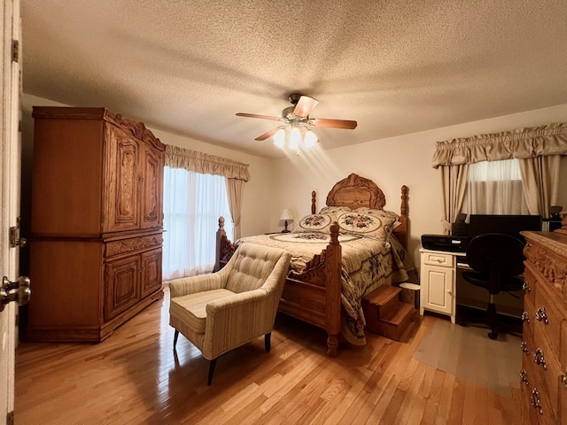 109 Preston Dr, Fitzgerald, GA 31750 - bedroom with light wood finished floors, a desk, a textured ceiling, and ceiling fan