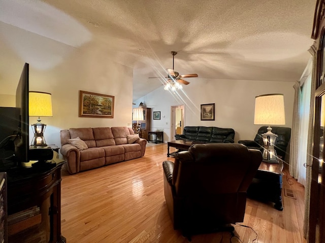 109 Preston Dr, Fitzgerald, GA 31750 - living area with vaulted ceiling, a textured ceiling, light wood-type flooring, and a ceiling fan