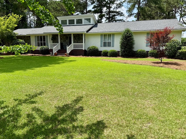7222 E Northgate Dr, Tifton, GA 31794 - view of front facade featuring a porch, a front yard, and roof with shingles