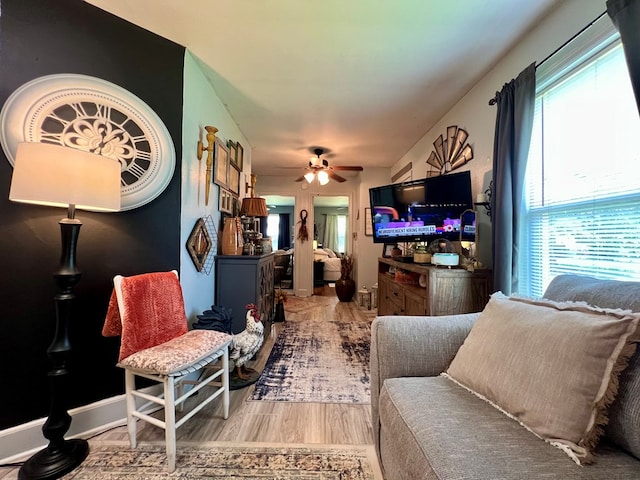 116 Branch Dr, Fitzgerald, GA 31750 - living area featuring healthy amount of natural light, ceiling fan, and wood finished floors