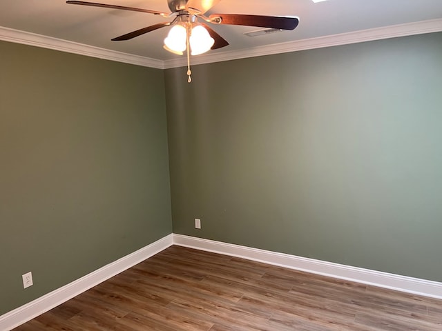 315 Newton Dr, Adel, GA 31620 - empty room with ornamental molding, baseboards, dark wood finished floors, and a ceiling fan