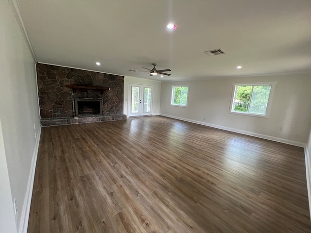 315 Newton Dr, Adel, GA 31620 - unfurnished living room with crown molding, baseboards, a fireplace, a ceiling fan, and wood finished floors