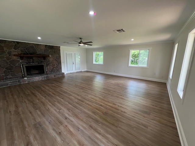 315 Newton Dr, Adel, GA 31620 - unfurnished living room with crown molding, baseboards, a fireplace, a ceiling fan, and dark wood-style flooring