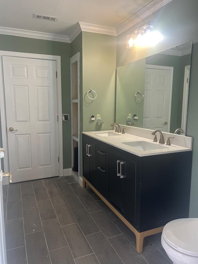315 Newton Dr, Adel, GA 31620 - bathroom featuring double vanity and ornamental molding