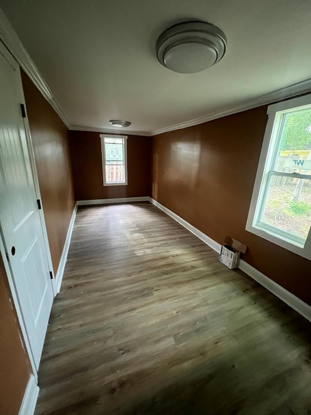 315 Newton Dr, Adel, GA 31620 - empty room with crown molding, baseboards, and wood finished floors