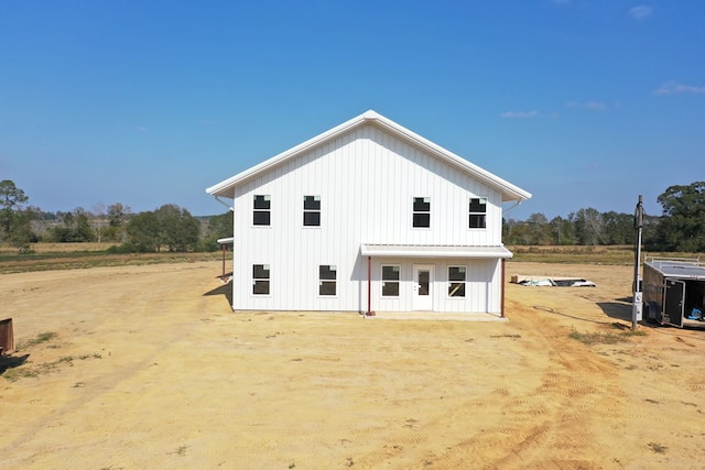 back of property with board and batten siding