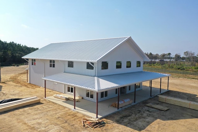 exterior space featuring a patio and metal roof