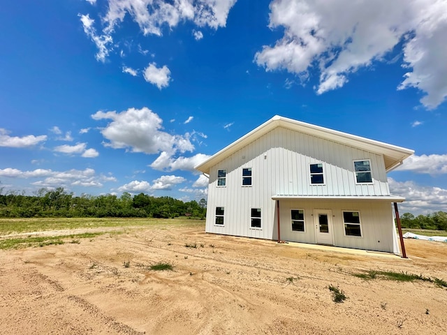 back of house with board and batten siding