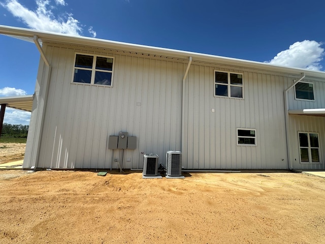 back of property featuring central AC unit