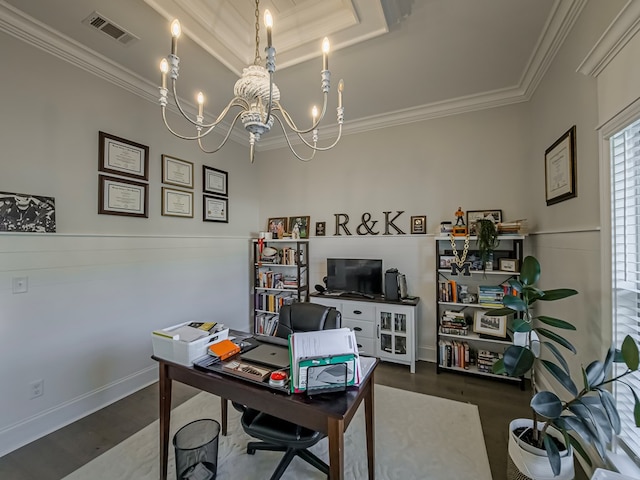 home office with a notable chandelier, a tray ceiling, crown molding, visible vents, and wood finished floors
