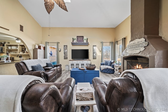 living room featuring hardwood / wood-style floors and ceiling fan