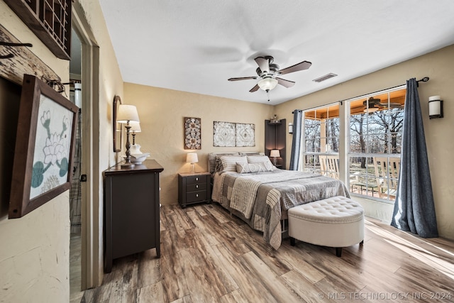 bedroom with ceiling fan and hardwood / wood-style flooring