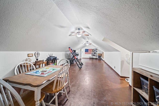 dining area with a textured ceiling, ceiling fan, and vaulted ceiling