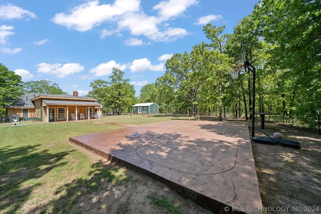 view of patio / terrace featuring a storage shed