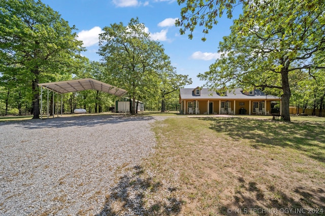 view of front of property featuring a carport and a front yard