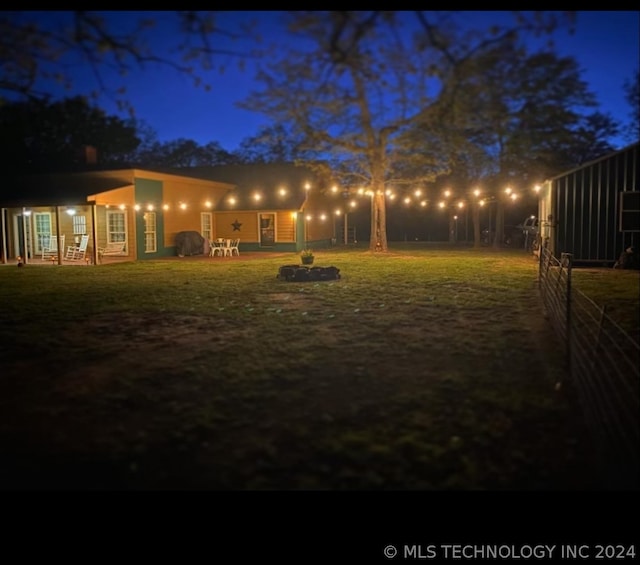 view of yard at night