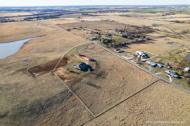 aerial view with a rural view and a water view