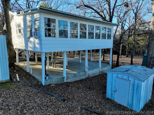 back of house with a patio